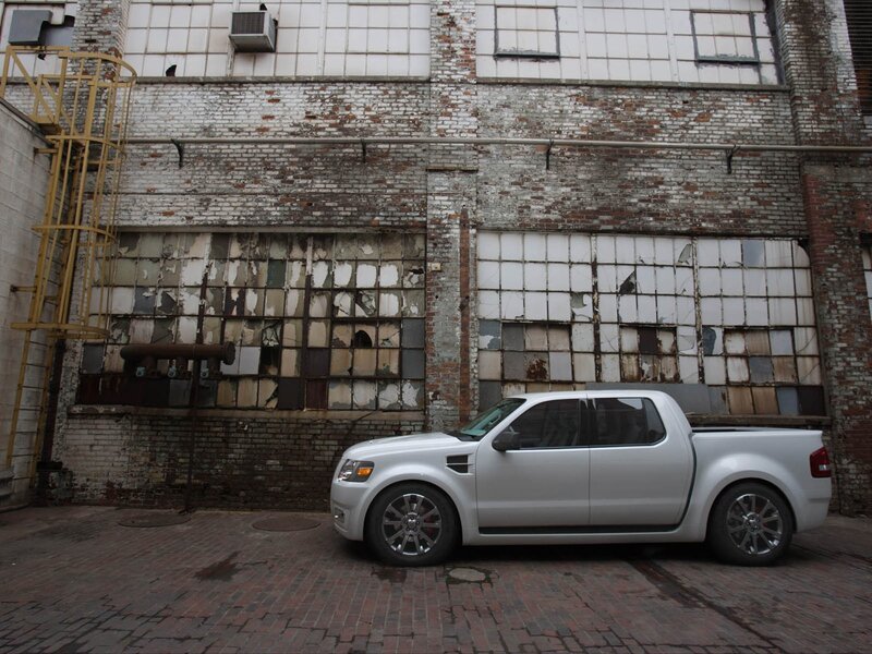 Silver pickup truck in alley