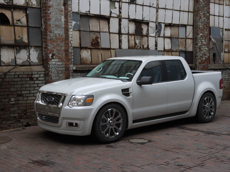 silver pickup truck in alley