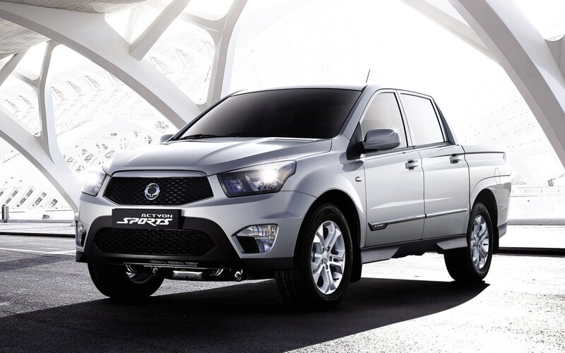 Silver pickup truck in modern structure