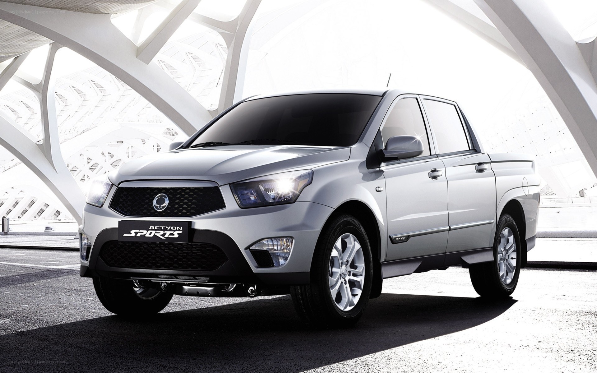 Silver pickup truck in modern structure