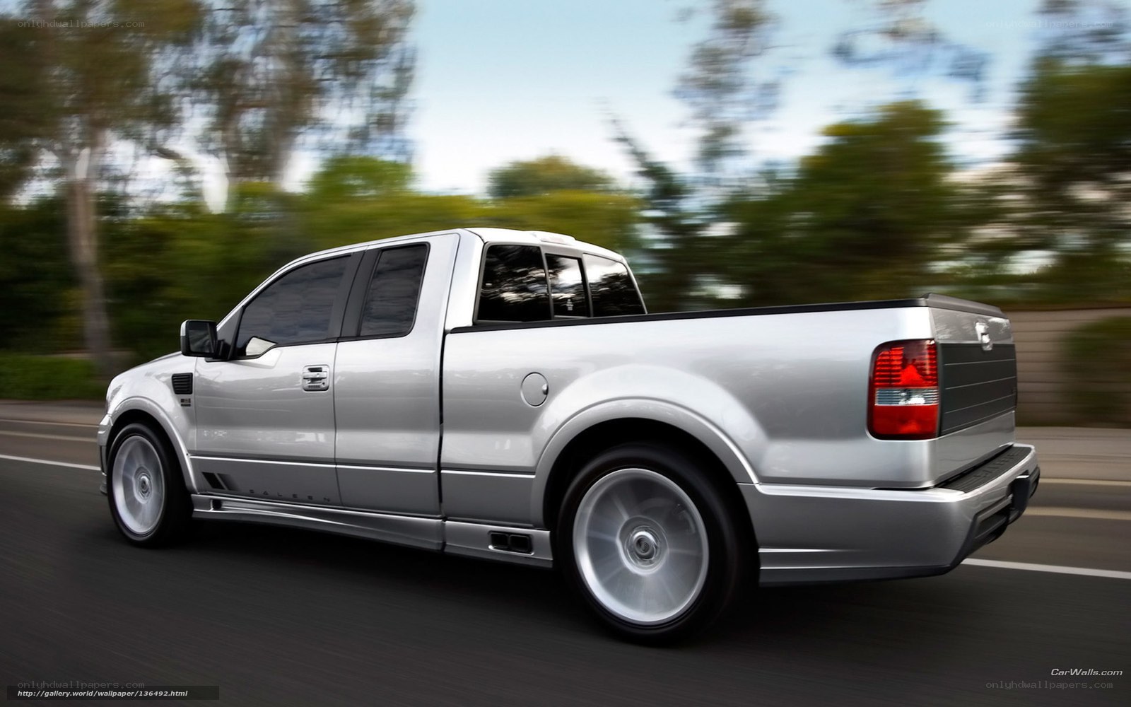 silver pickup truck in motion