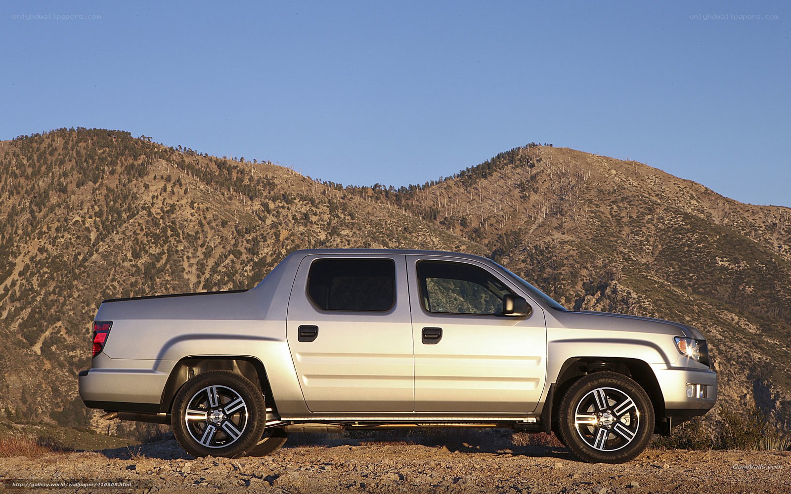 silver pickup truck in mountains