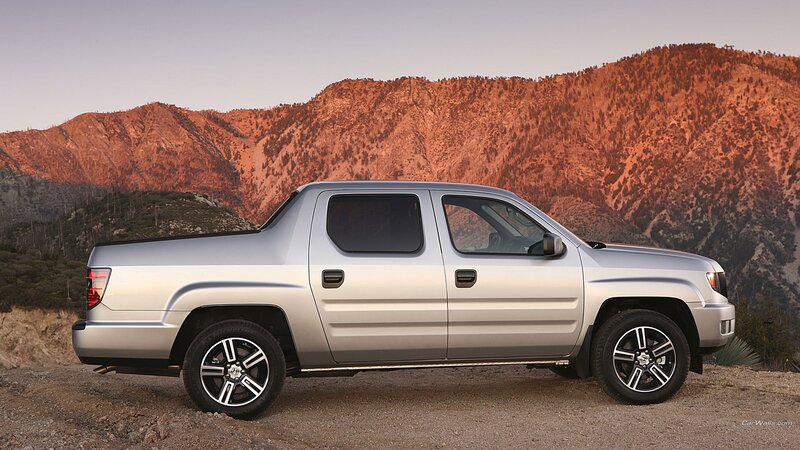 silver pickup truck in mountains