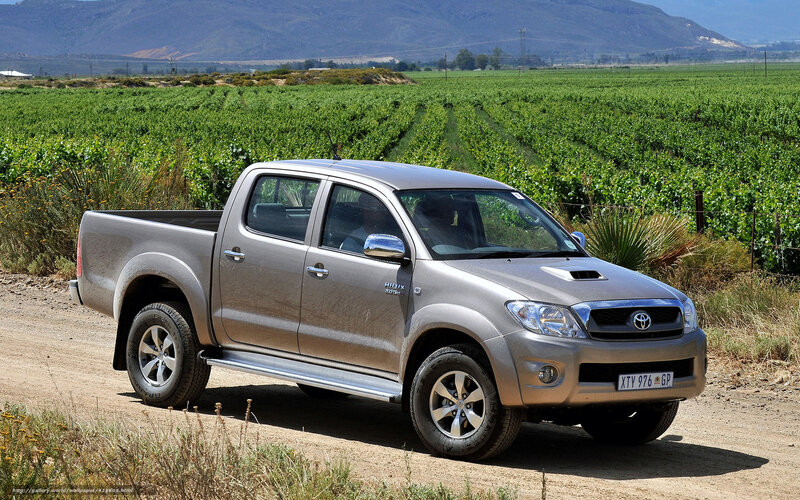 Silver pickup truck in vineyard