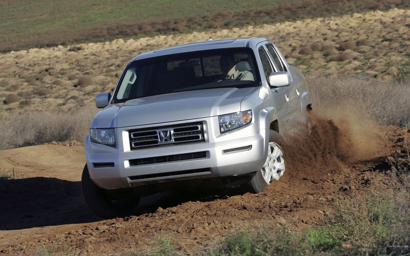 silver pickup truck on dirt road