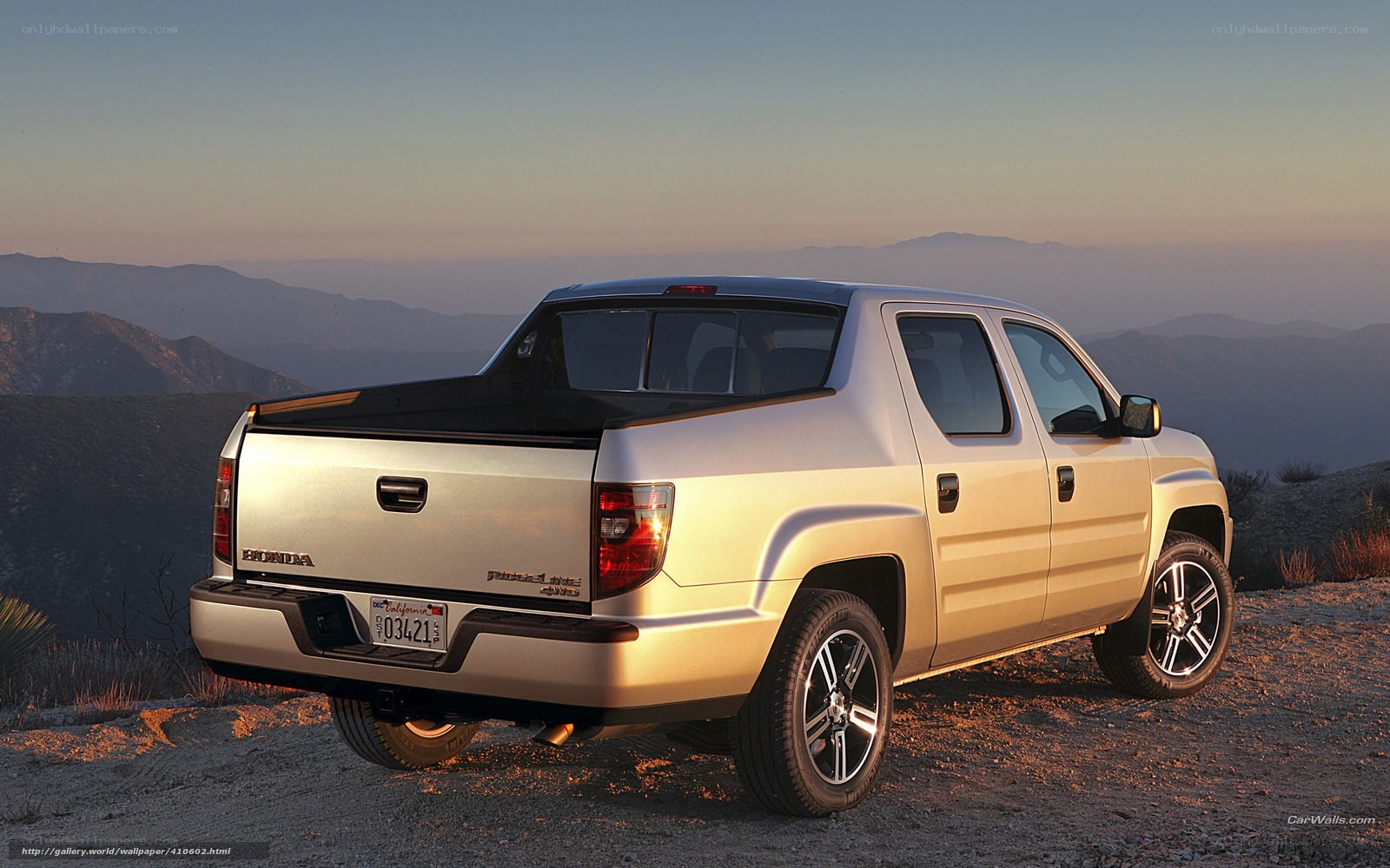 silver pickup truck on mountain overlook