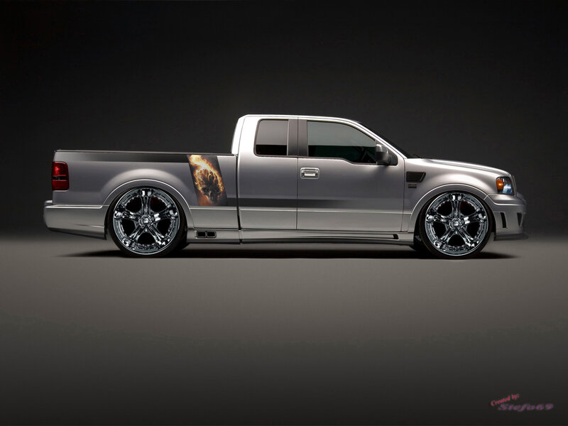 silver pickup truck with flame decal