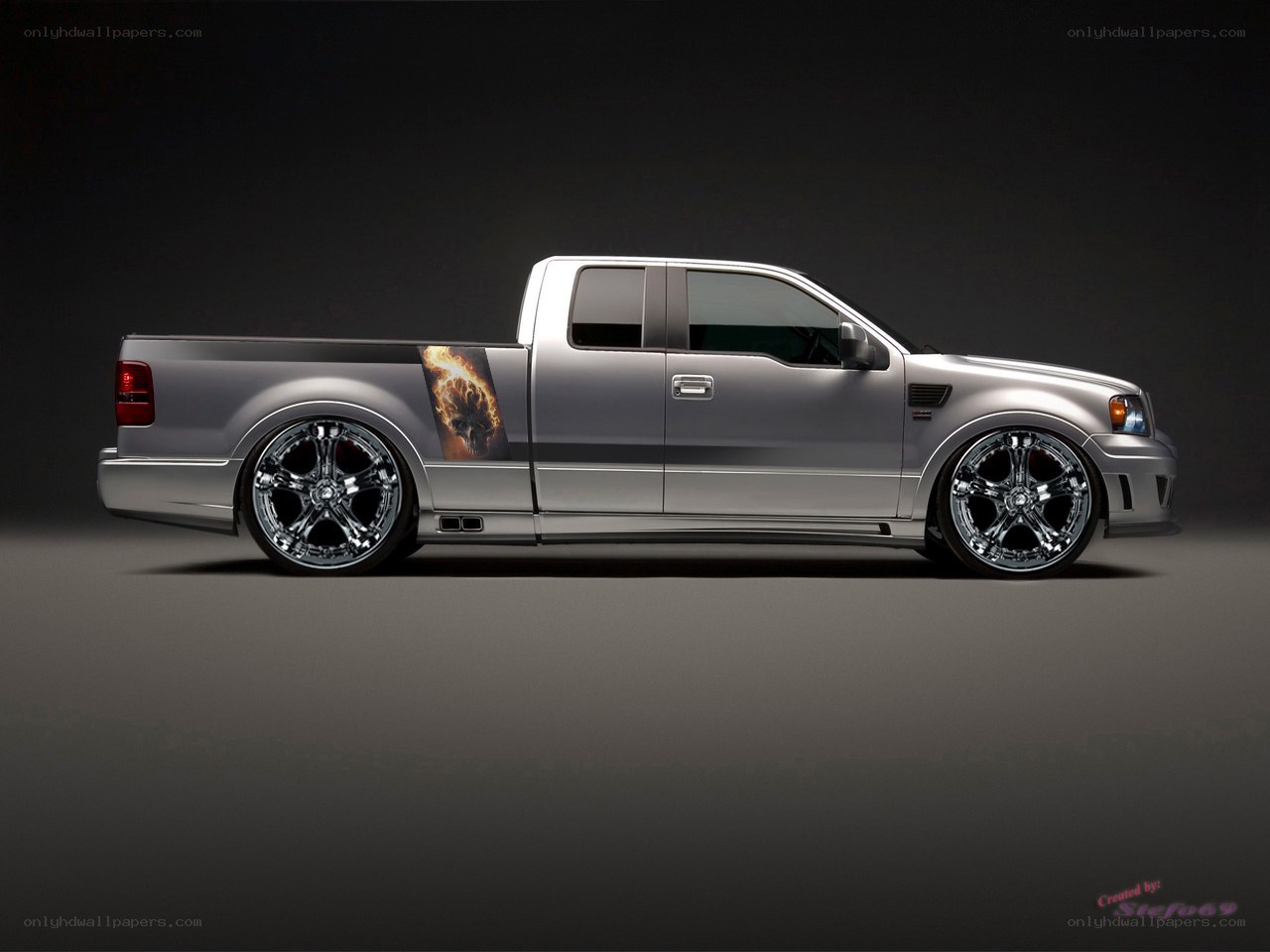 silver pickup truck with flame decal