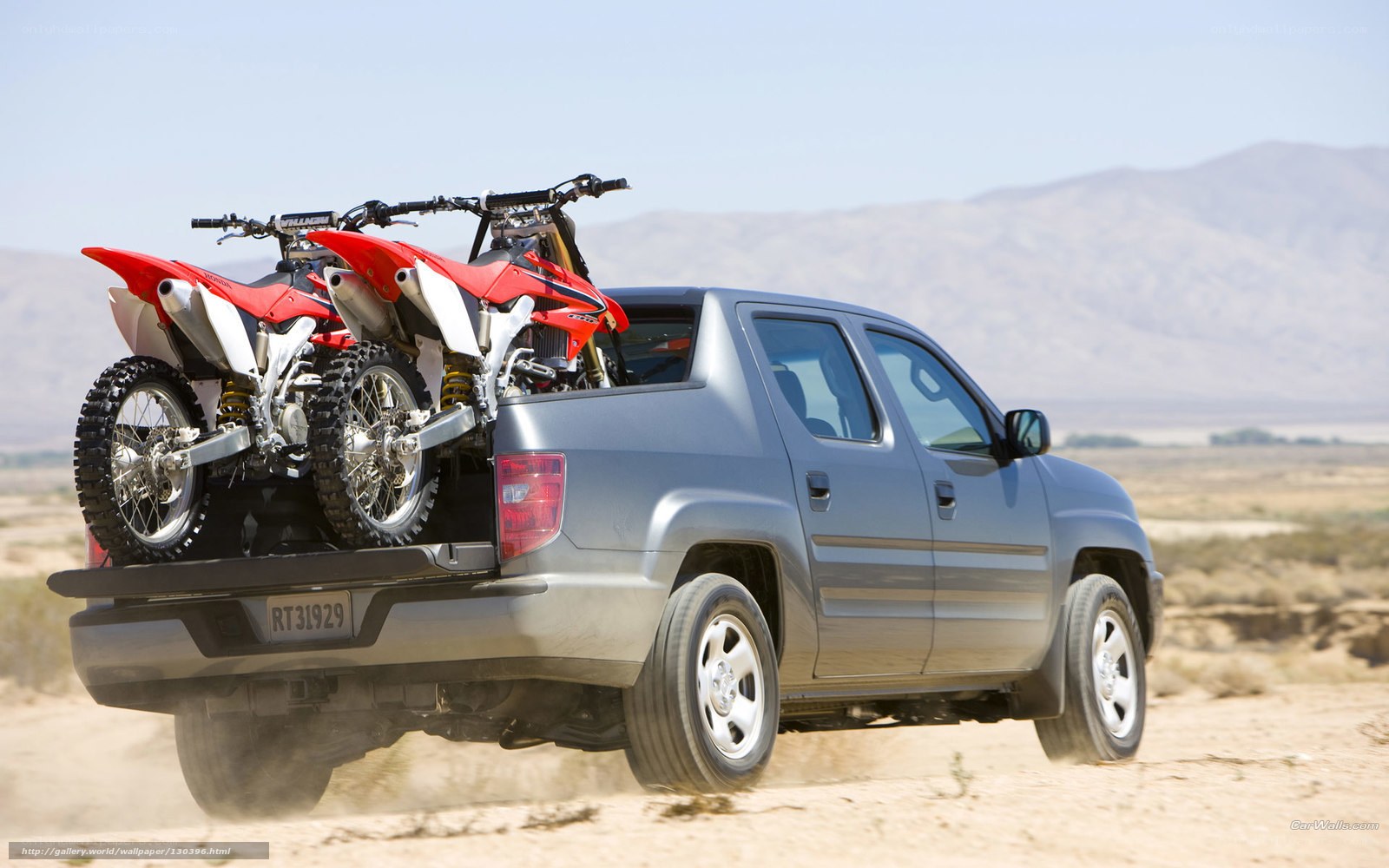 Silver pickup with dirt bikes