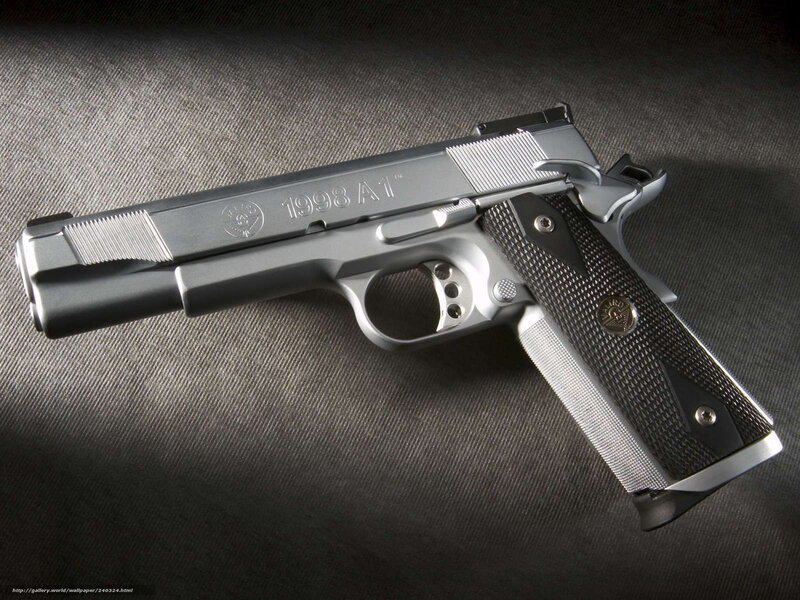 silver pistol on fabric
