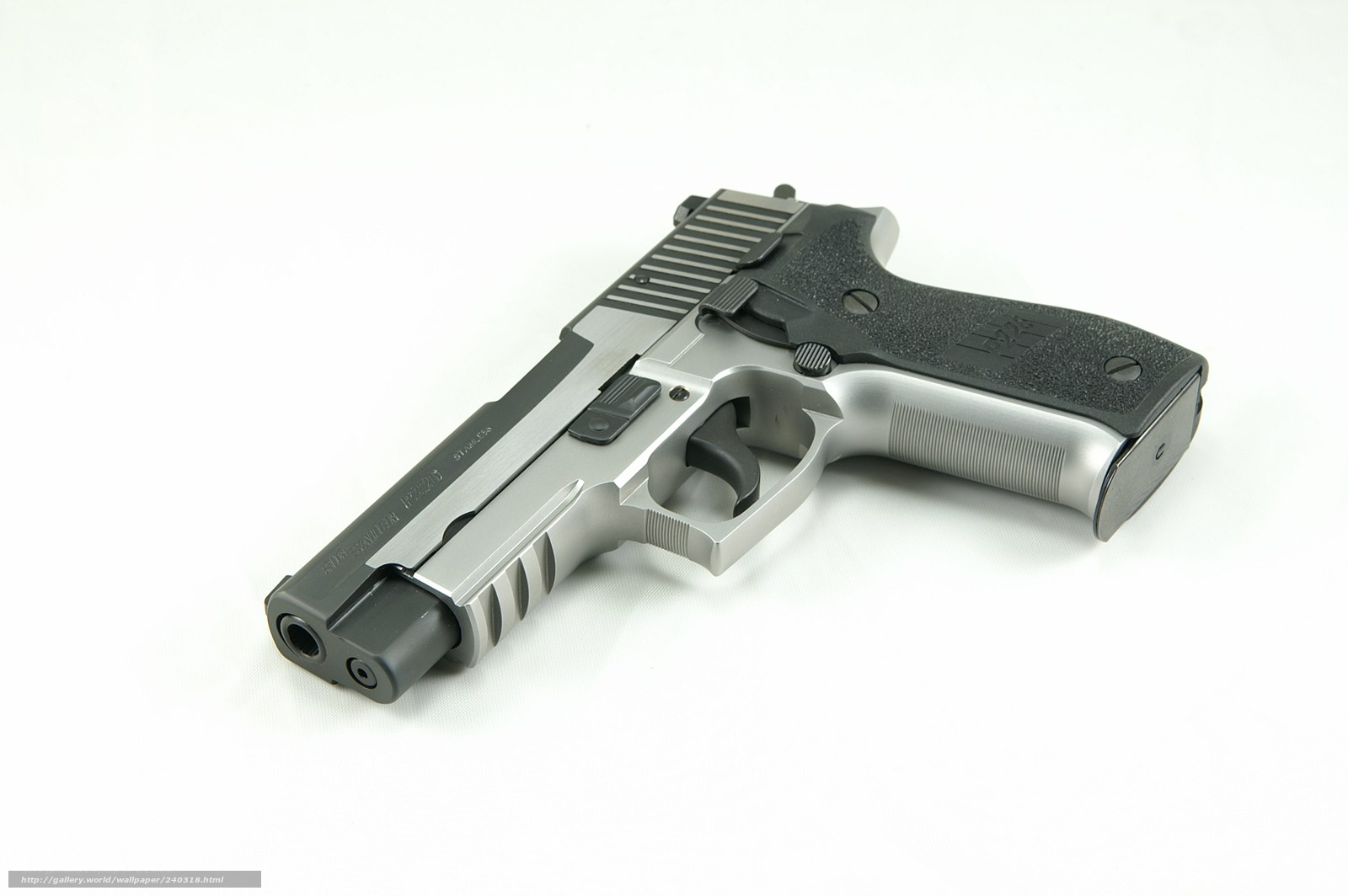silver pistol on white background