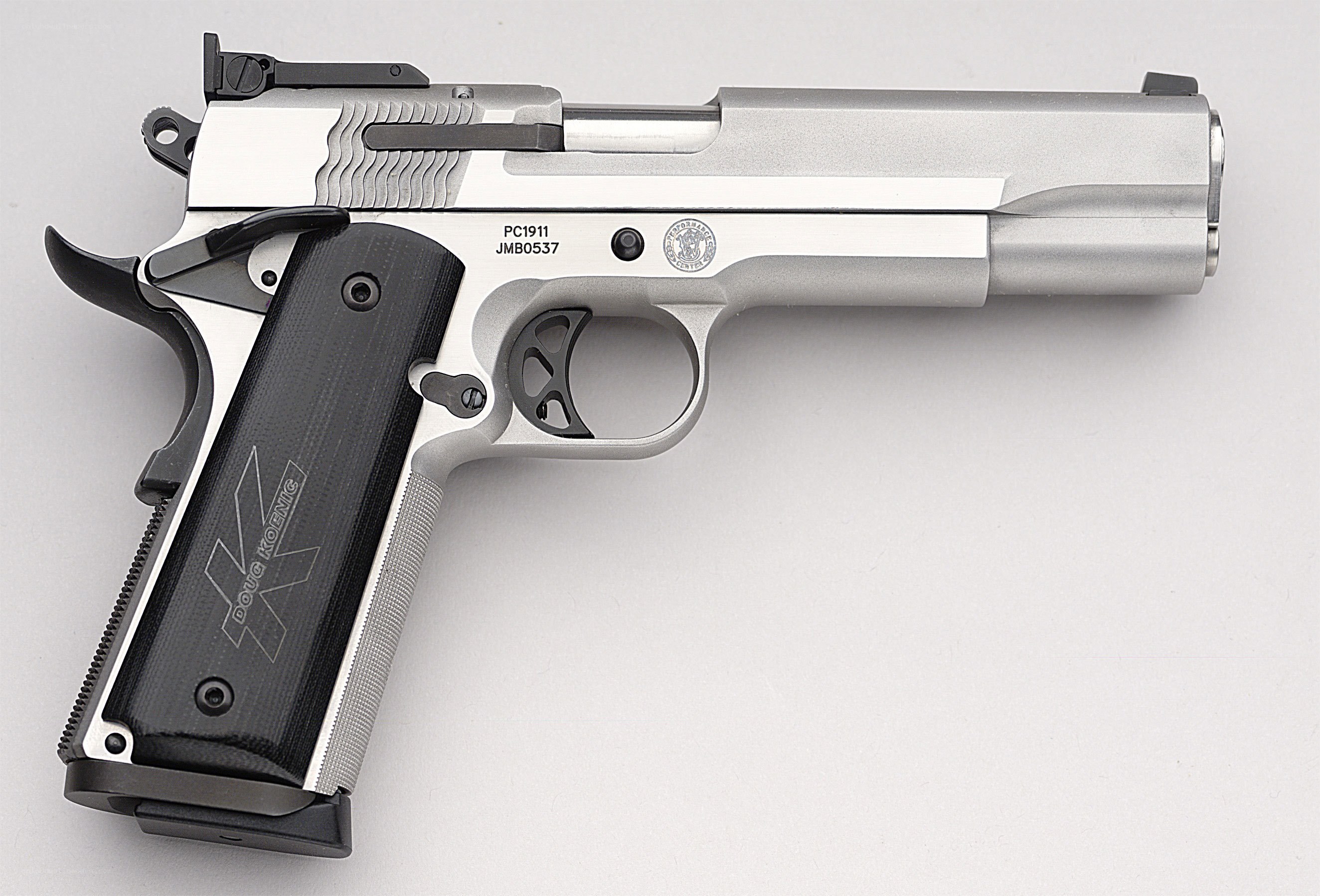 silver pistol with black grip