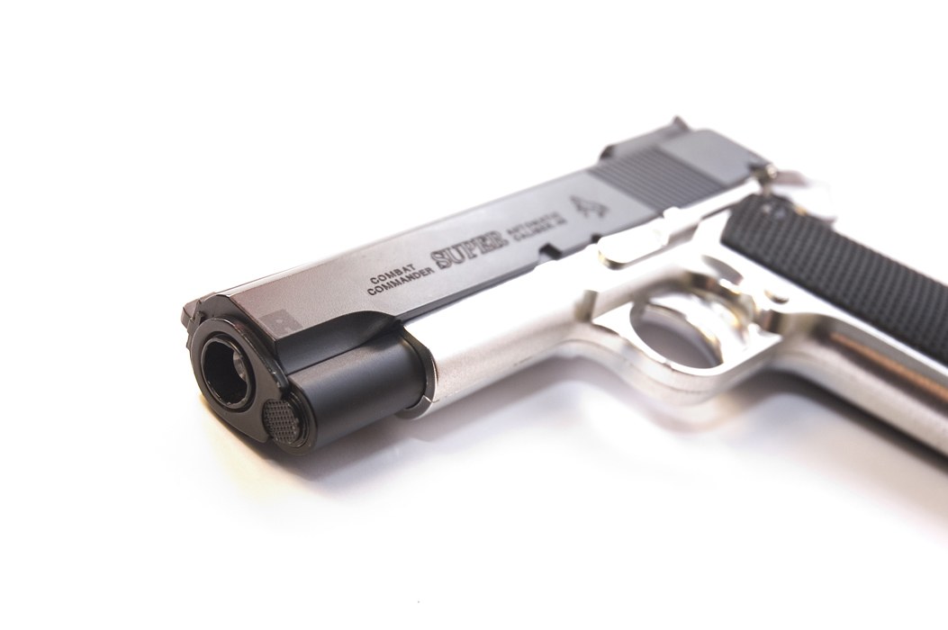 silver pistol with black grip