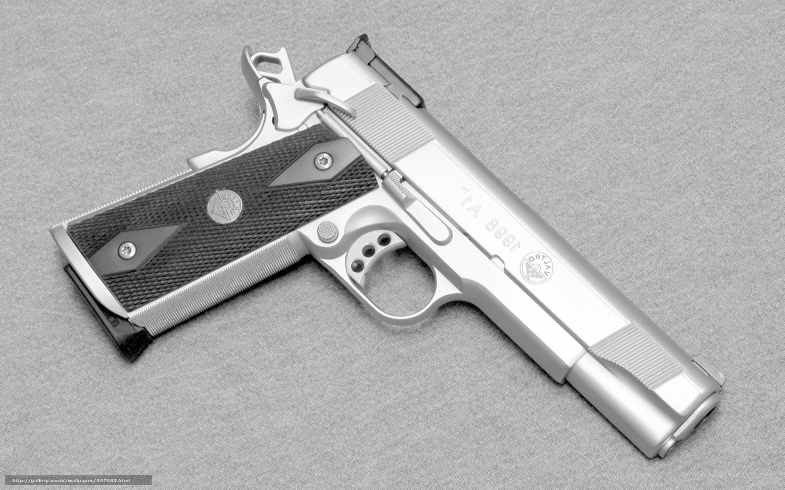 silver pistol with black grip
