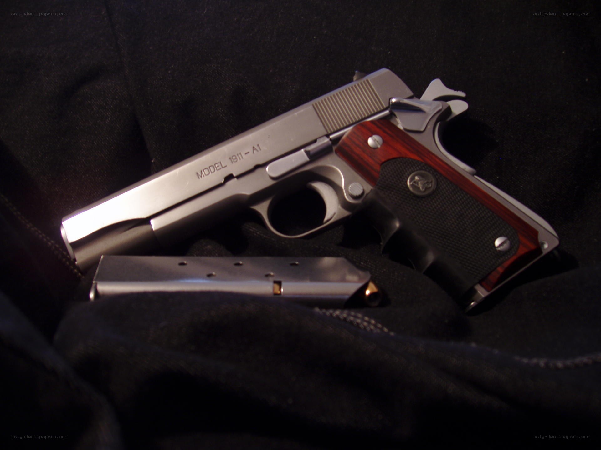 silver pistol with magazine