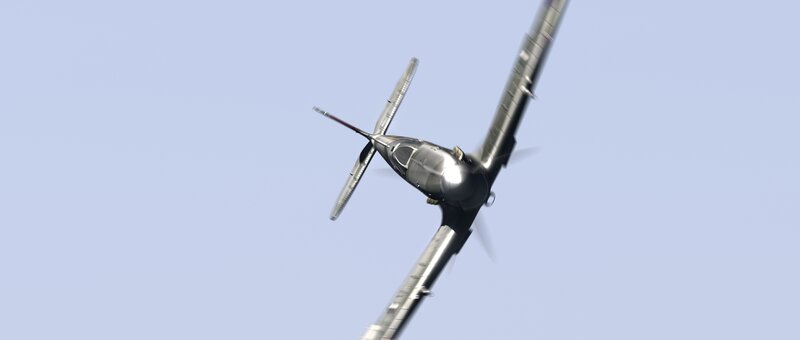 silver plane in flight