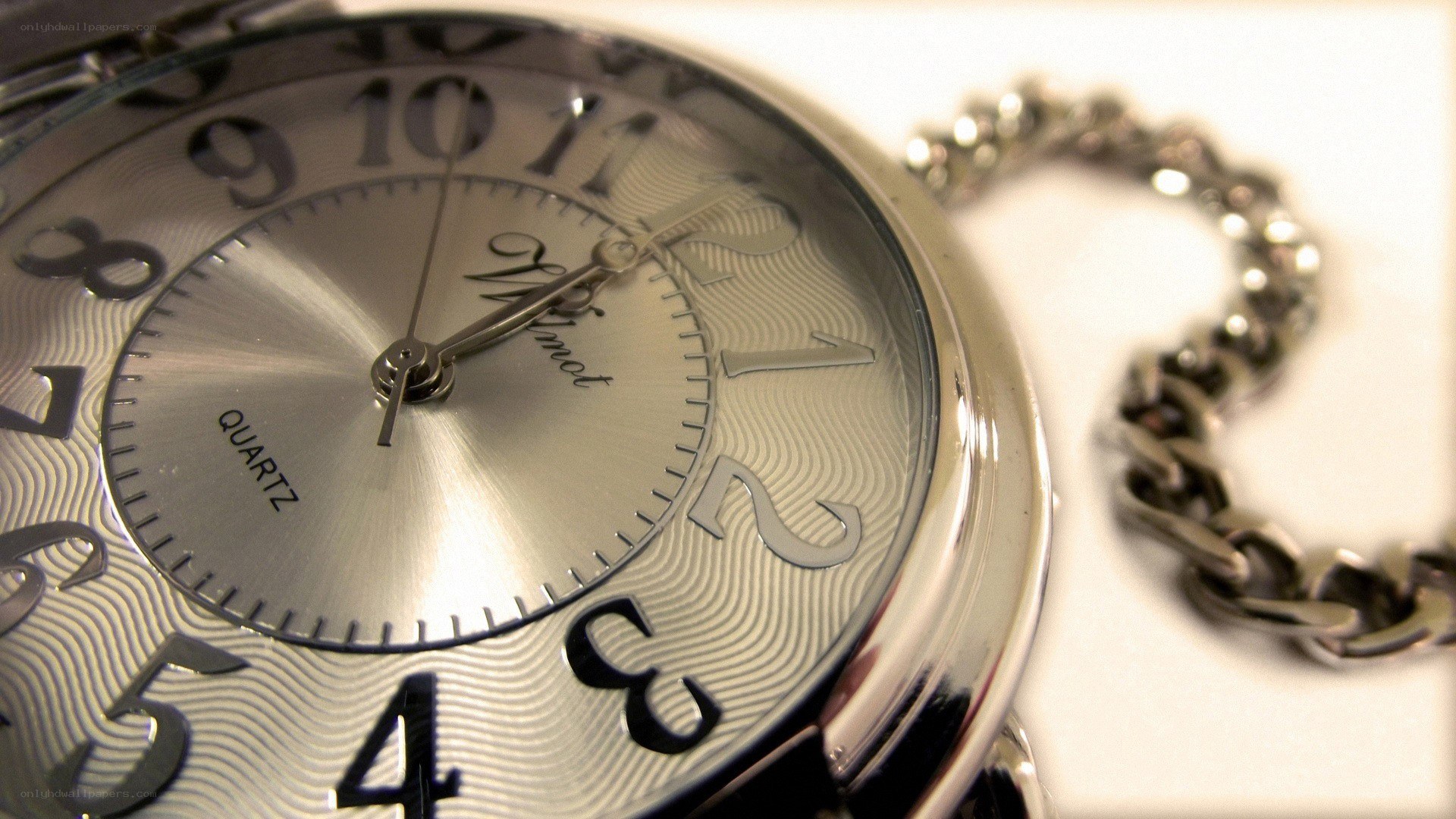 silver pocket watch with chain