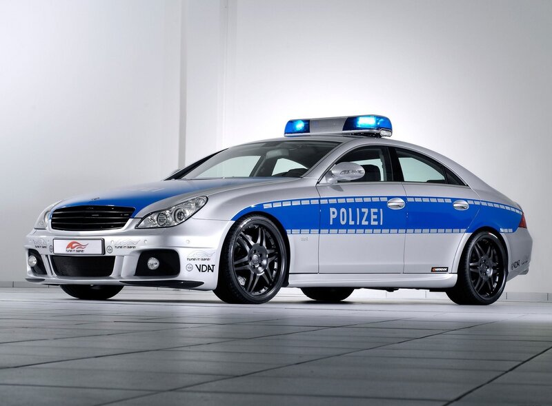 silver police car with blue lights