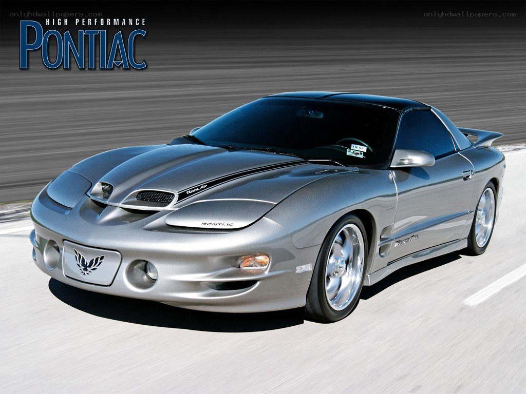 Silver Pontiac Firebird in motion