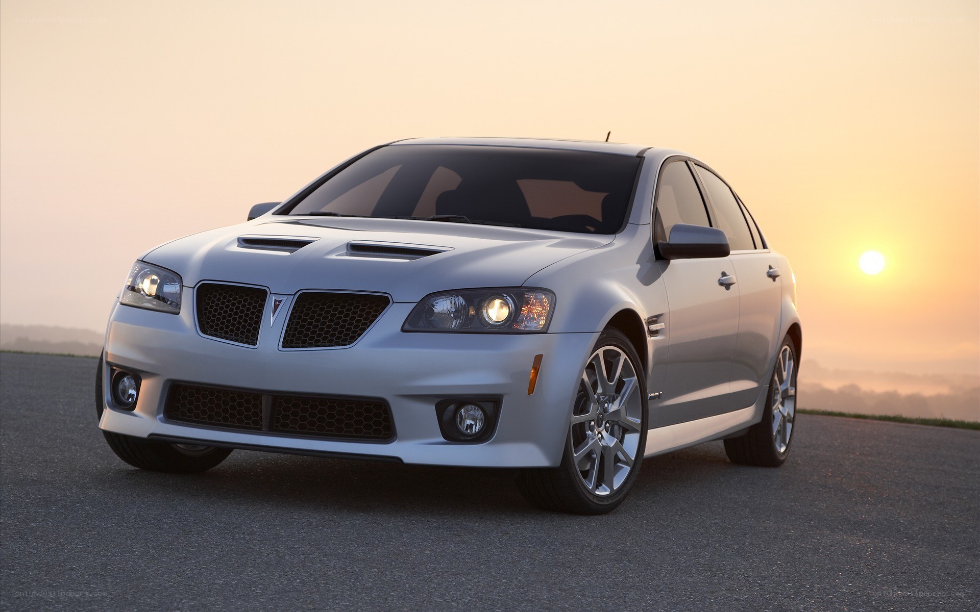 silver pontiac g8 in sunset