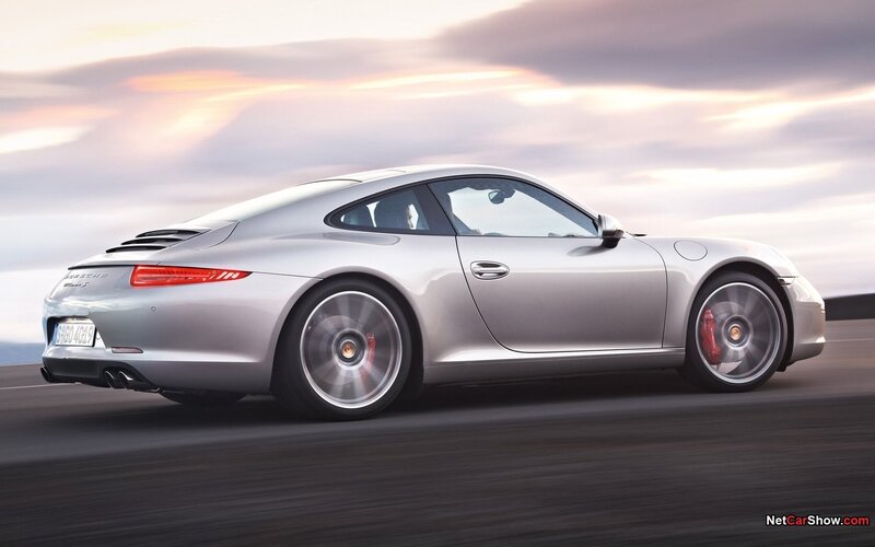 silver porsche 911 in motion