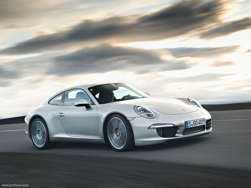 silver porsche 911 in motion