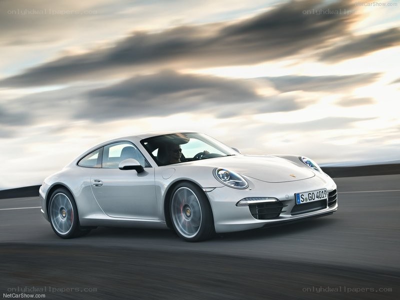 silver porsche 911 in motion