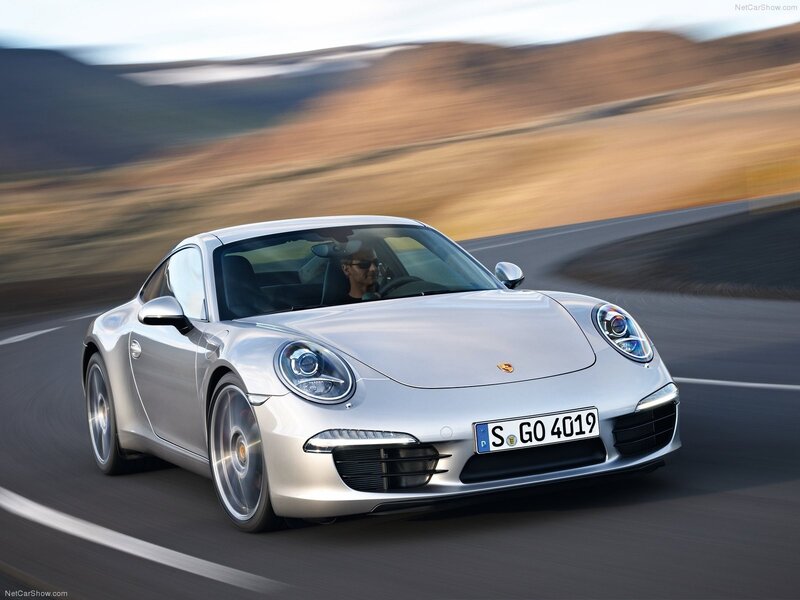 silver porsche 911 in motion