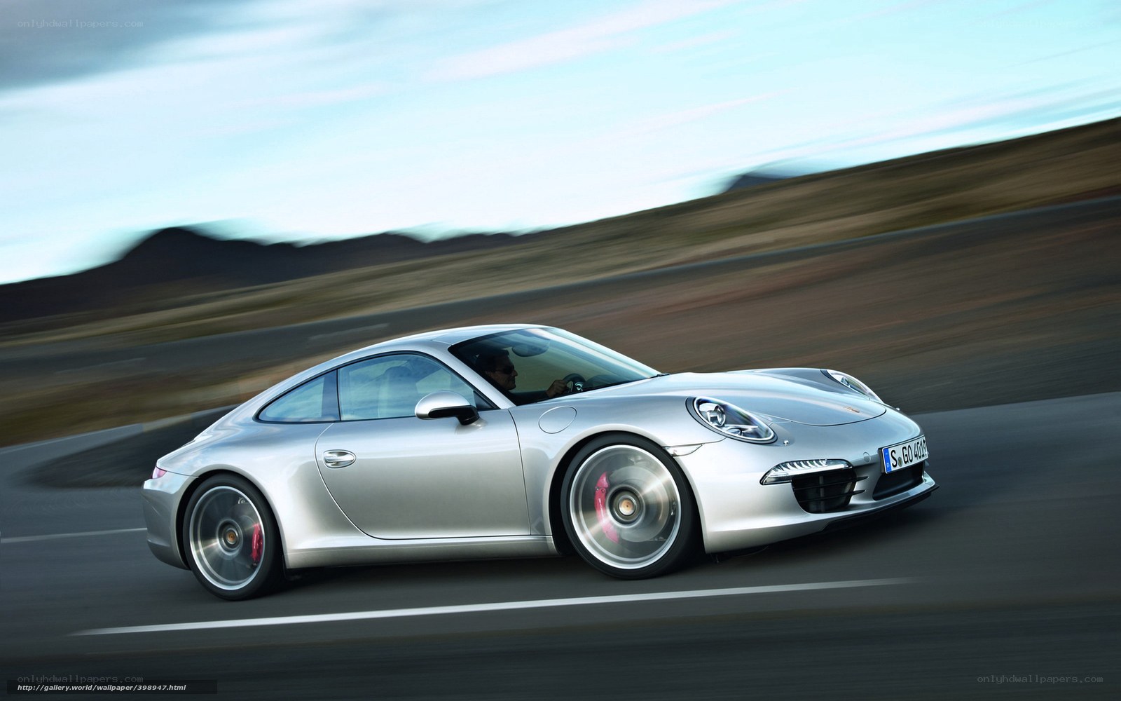 silver porsche 911 in motion