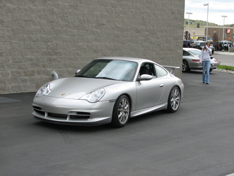 Silver Porsche 911 in parking lot
