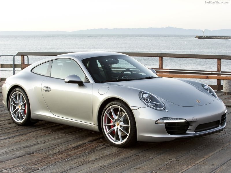 silver porsche 911 on a pier