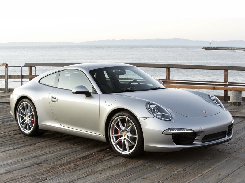 Silver Porsche 911 on a pier
