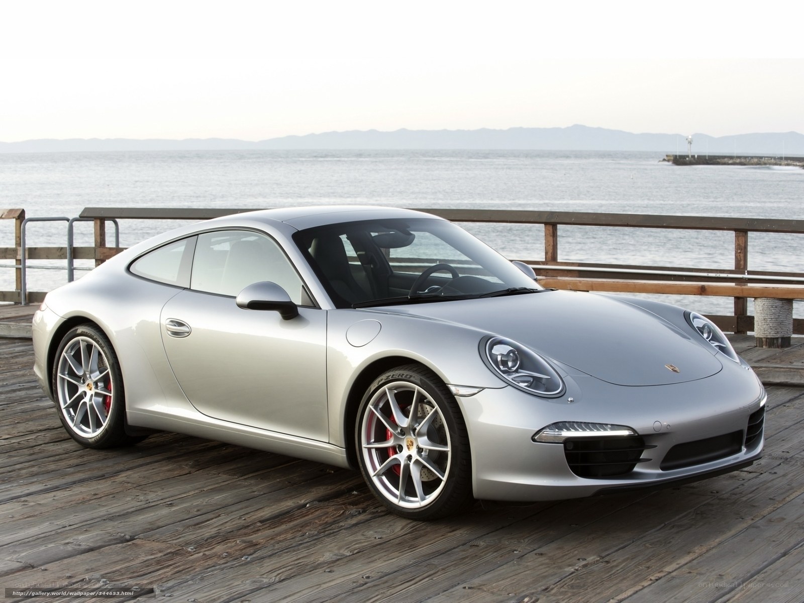 Silver Porsche 911 on a pier