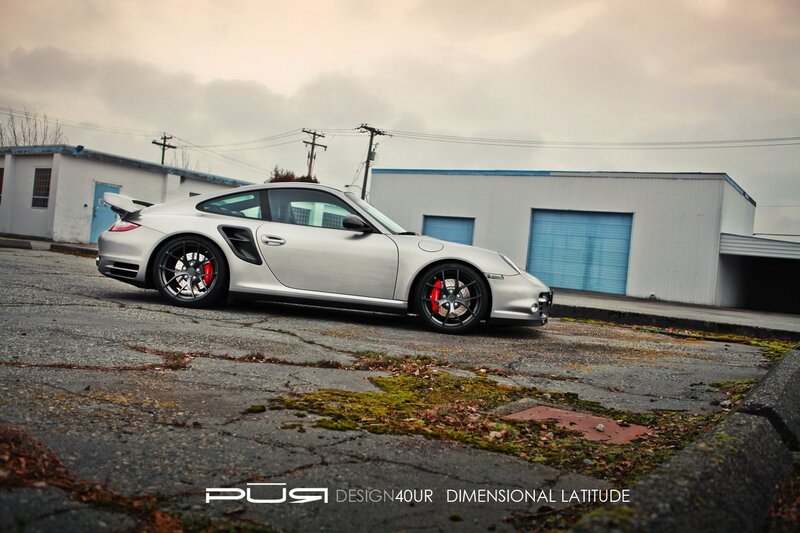 silver porsche 911 on cracked pavement