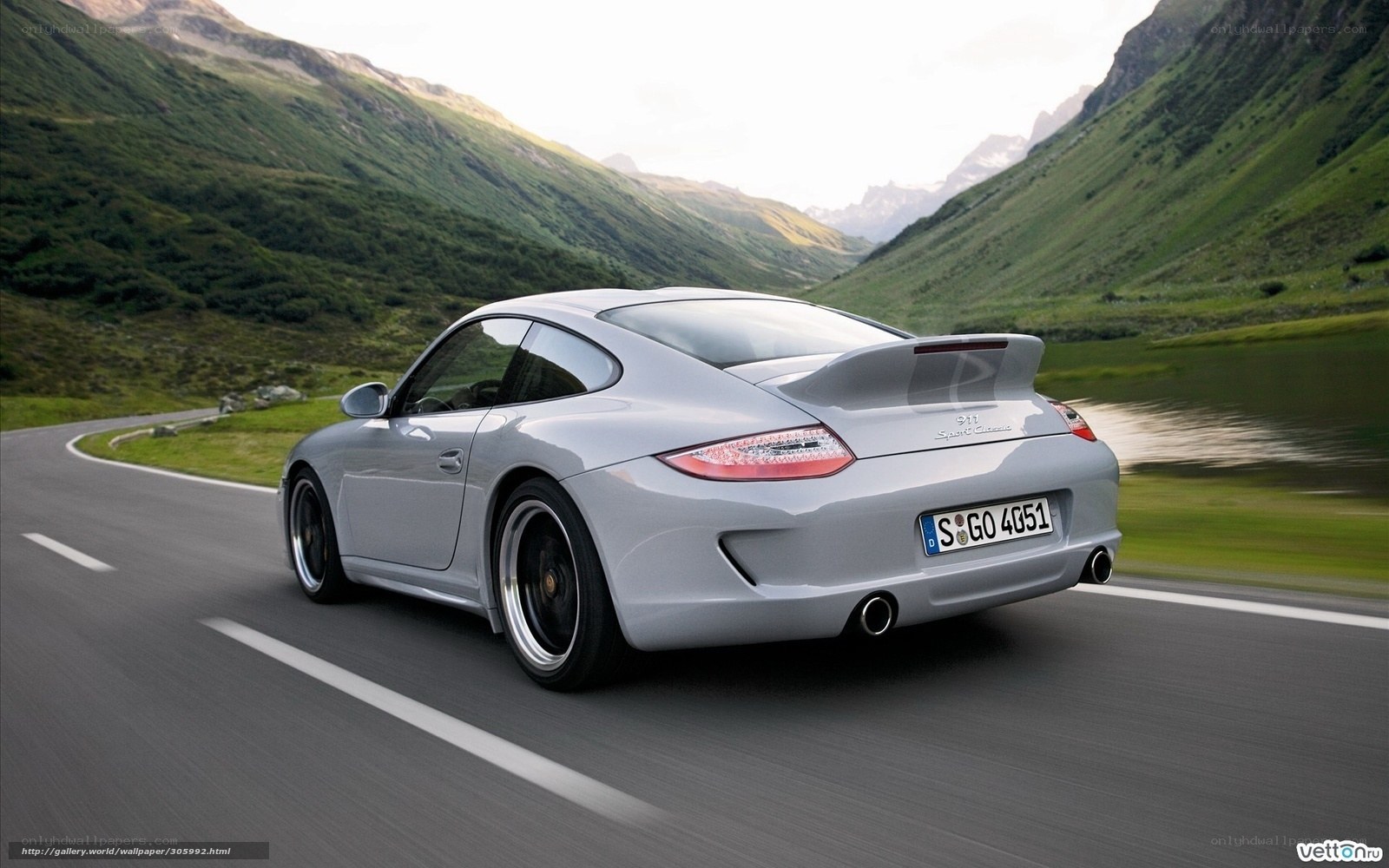 silver porsche 911 on mountain road