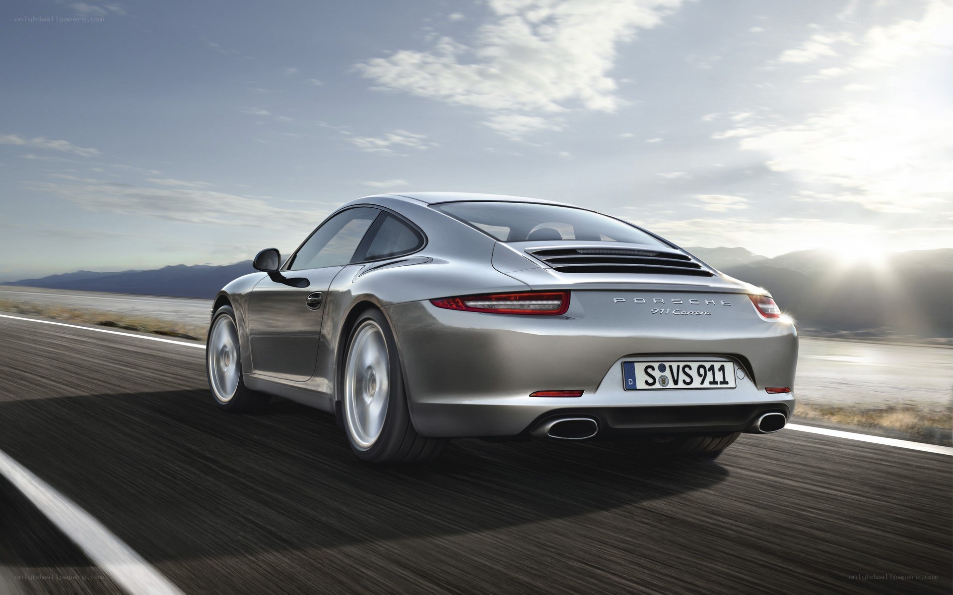 silver porsche 911 on road