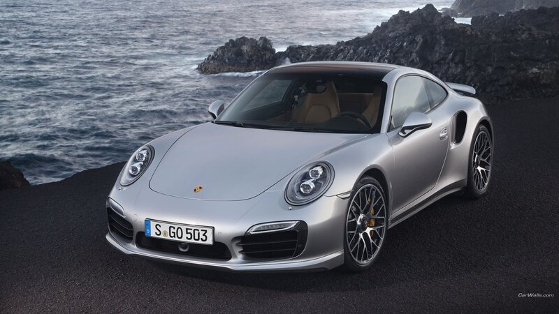 Silver Porsche 911 Turbo by the sea