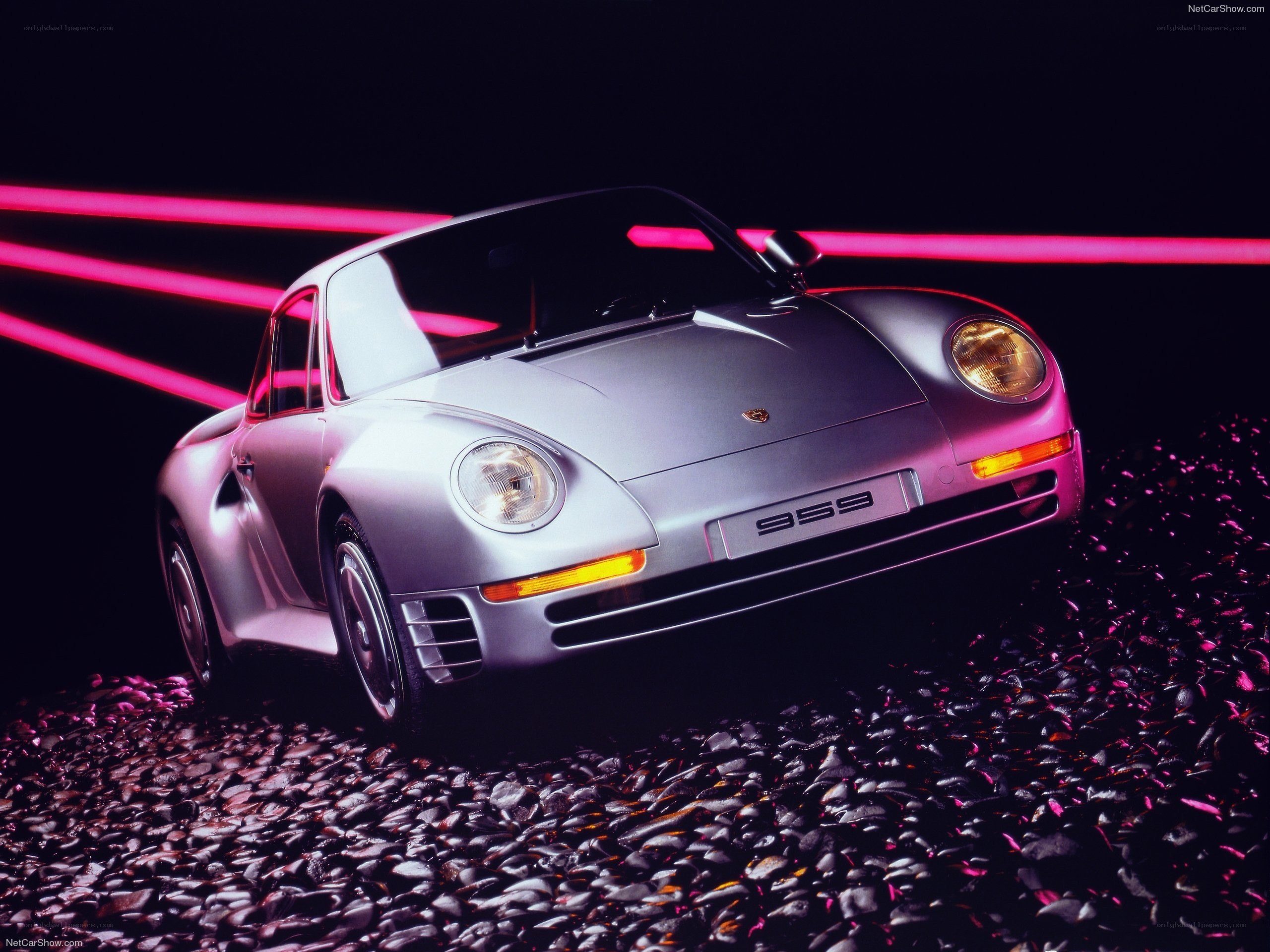 Silver Porsche 959 on pebbles
