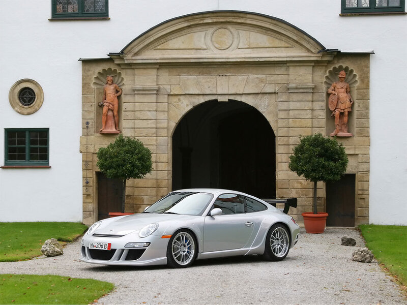 Silver Porsche at historic entrance