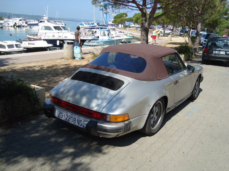 Silver Porsche at marina