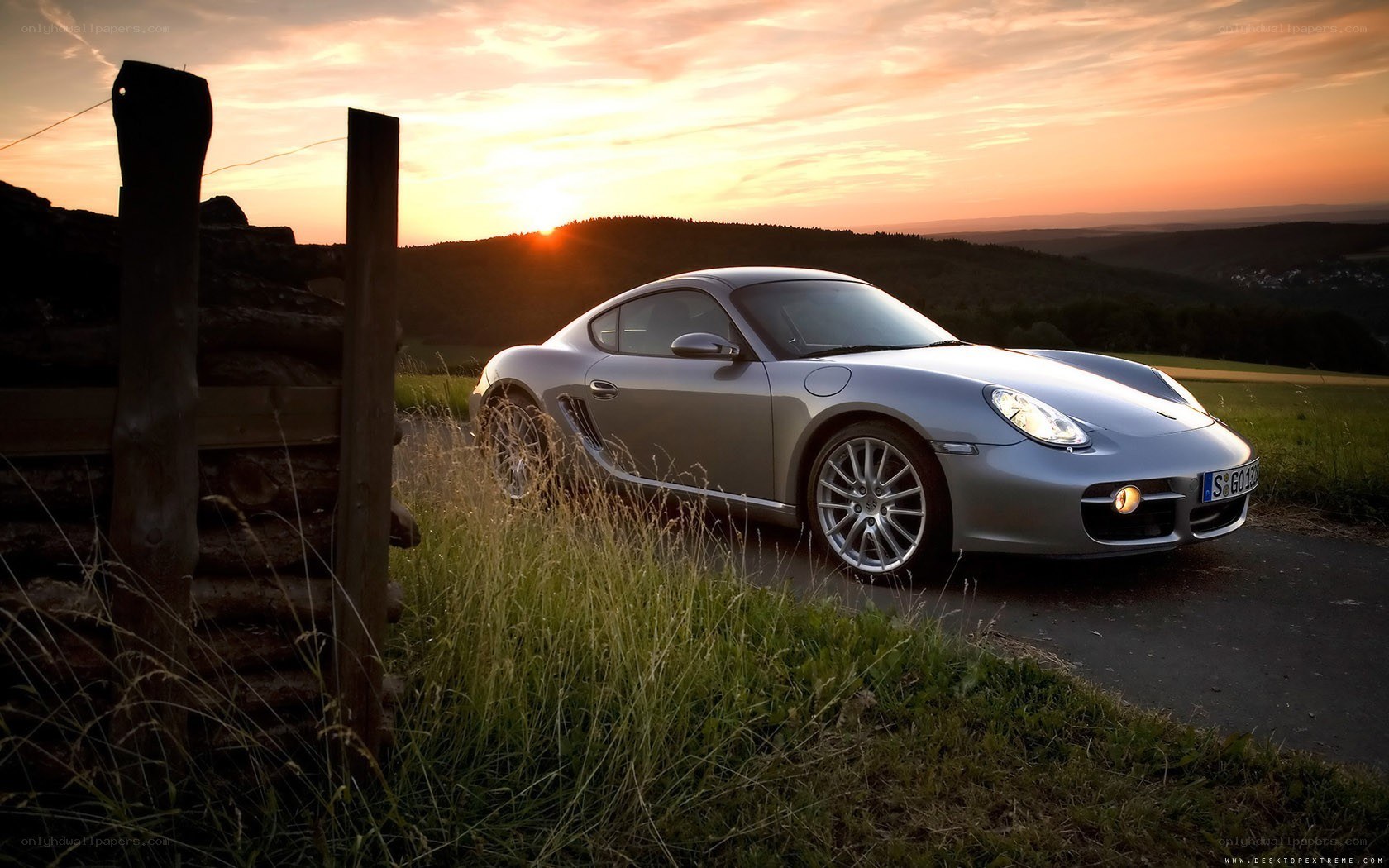 Silver Porsche at sunset