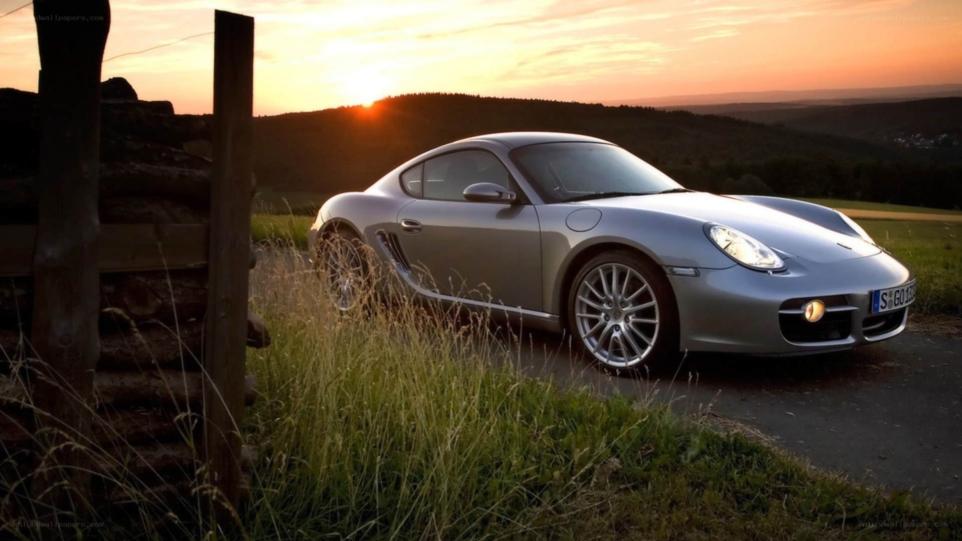 Silver Porsche at sunset