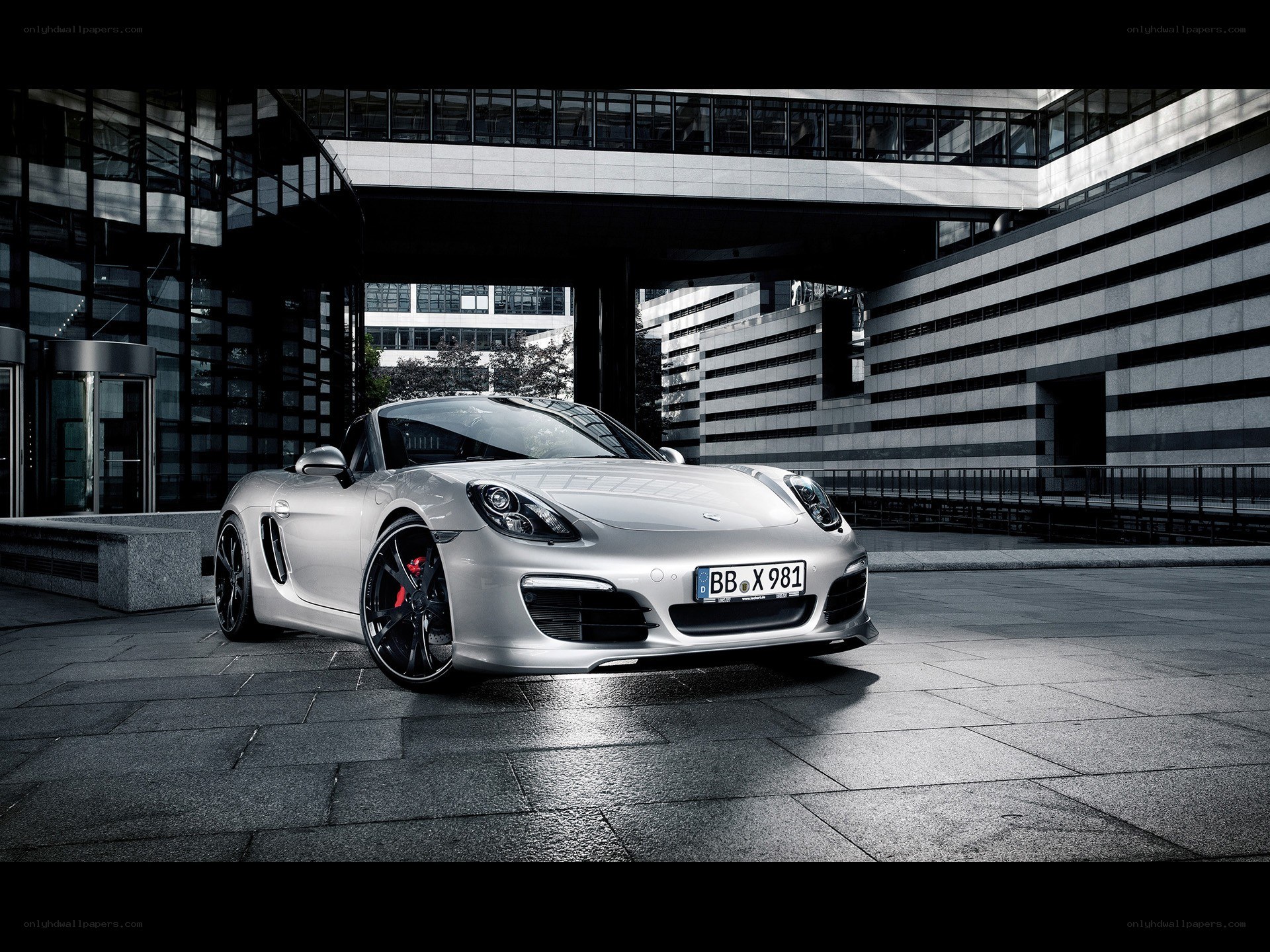Silver Porsche Boxster in urban setting