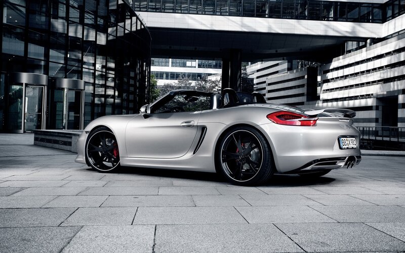 Silver Porsche Boxster parked outside
