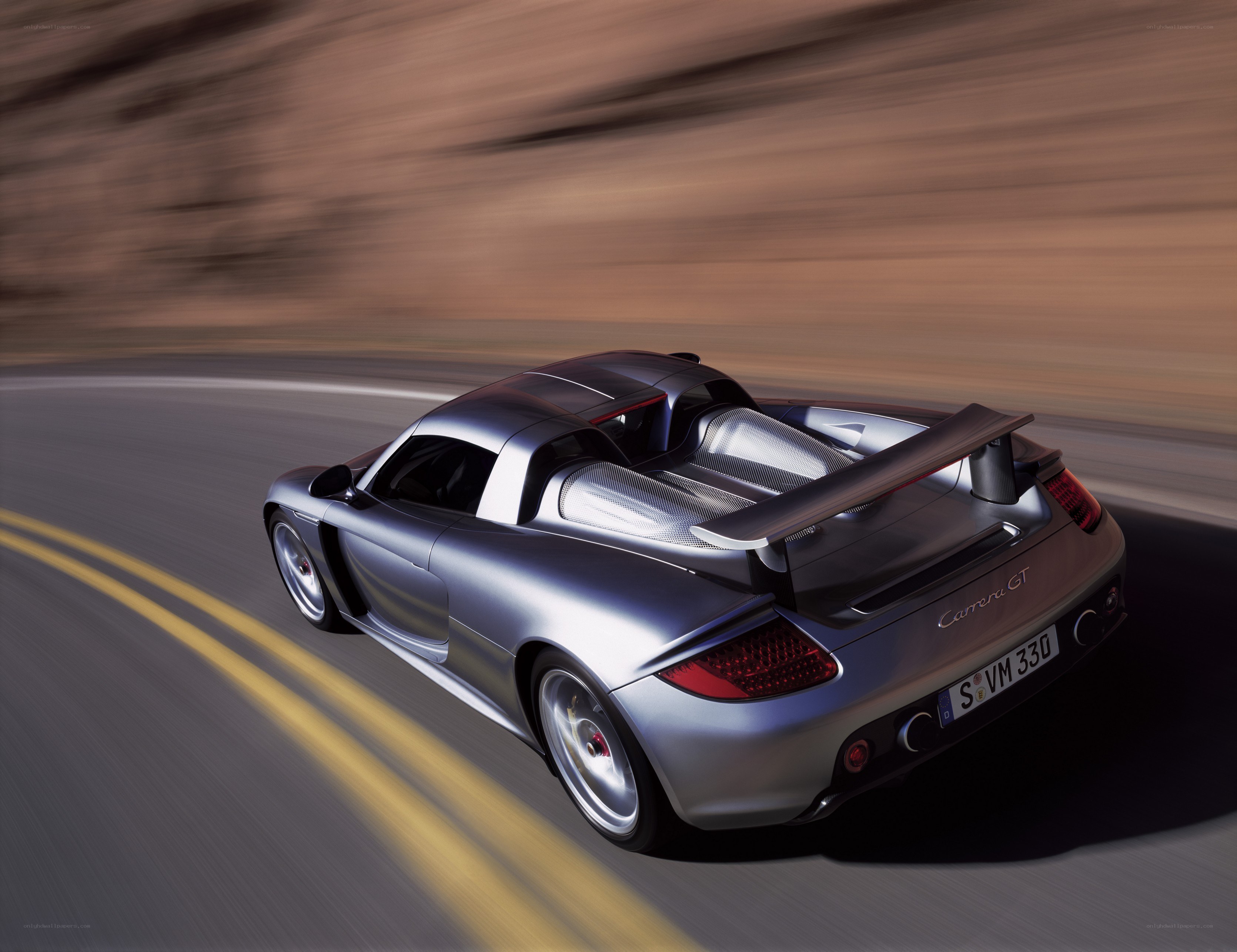 silver porsche carrera gt