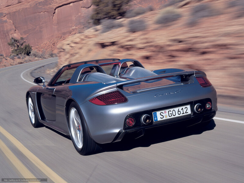 silver porsche carrera gt driving