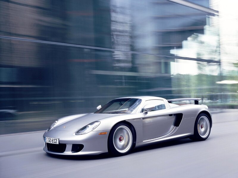Silver Porsche Carrera GT in motion