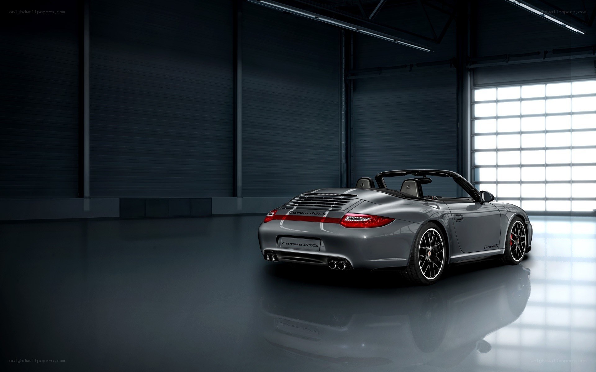 Silver Porsche Carrera GTS convertible