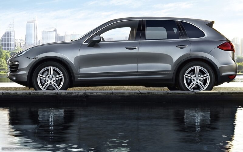 silver porsche cayenne by water