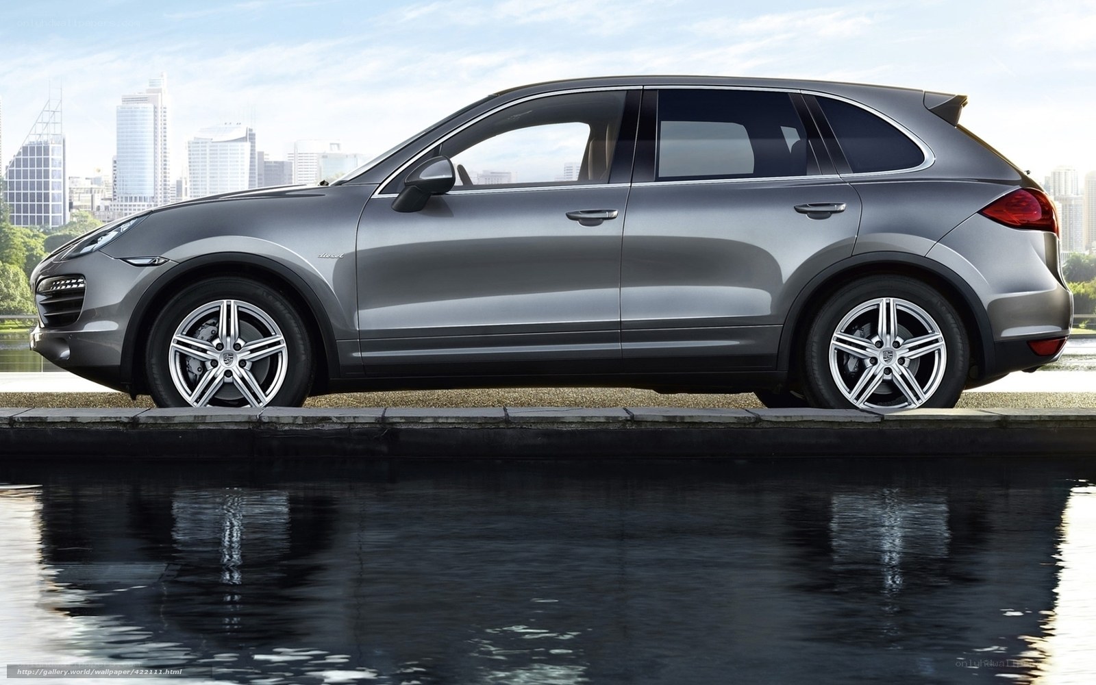 silver porsche cayenne by water